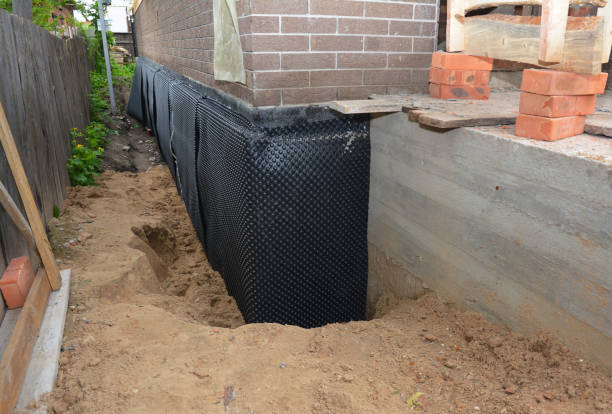 Happy homeowners after waterproofing job in Retsof